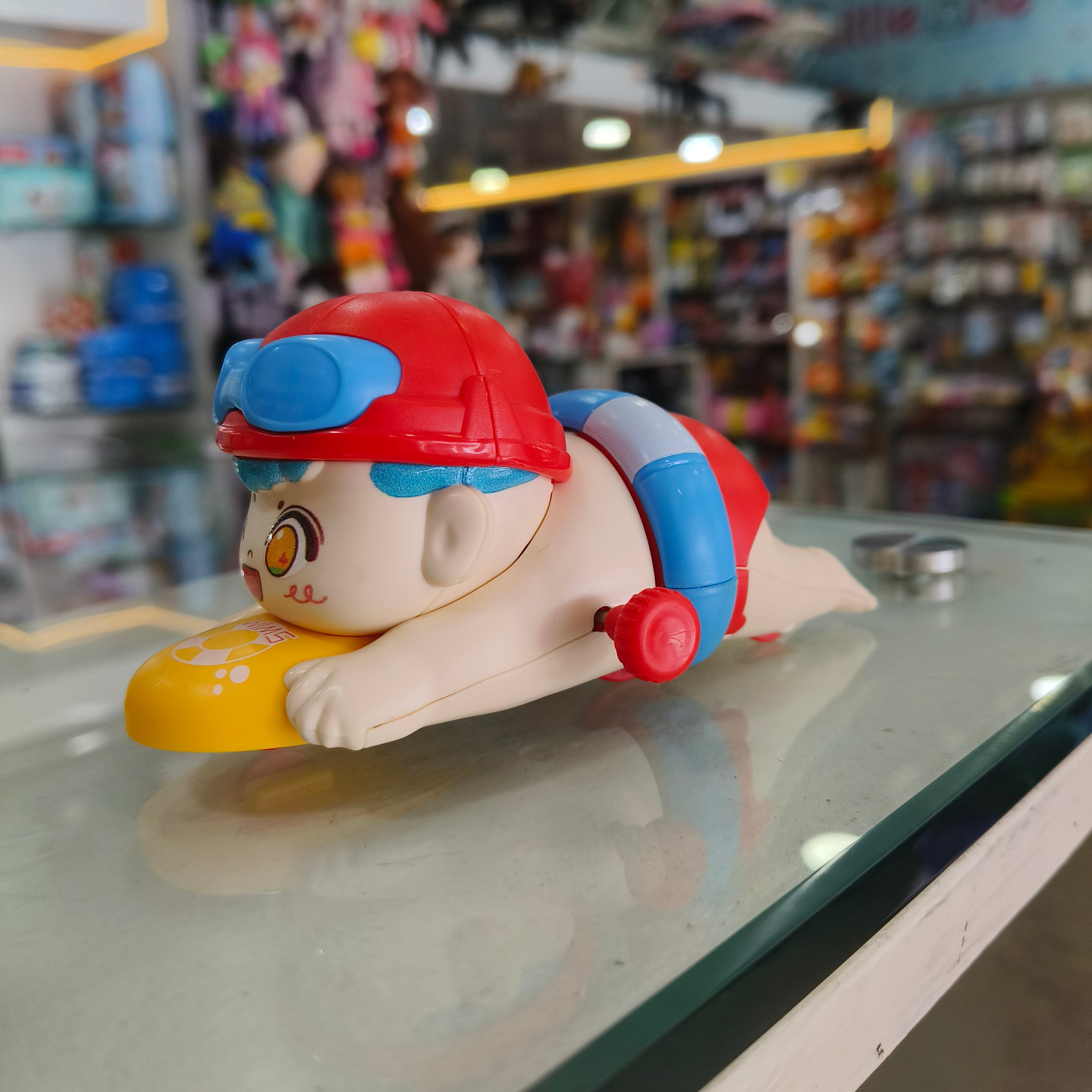 Swimmer Boy Surfboard Wind-Up Water & Floor Toy